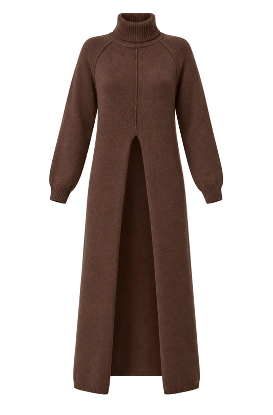 A long, dark brown turtleneck sweater dress with raglan sleeves and a front slit, displayed on a neutral beige background.